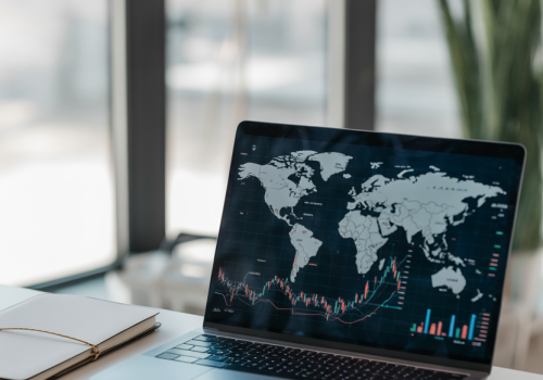 ideogram-v3.0_international_investment_concept_world_map_with_financial_charts_and_graphs_lapt-0